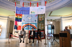 Hudson Unveils Section of AIDS Memorial Quilt at Brennan Courthouse