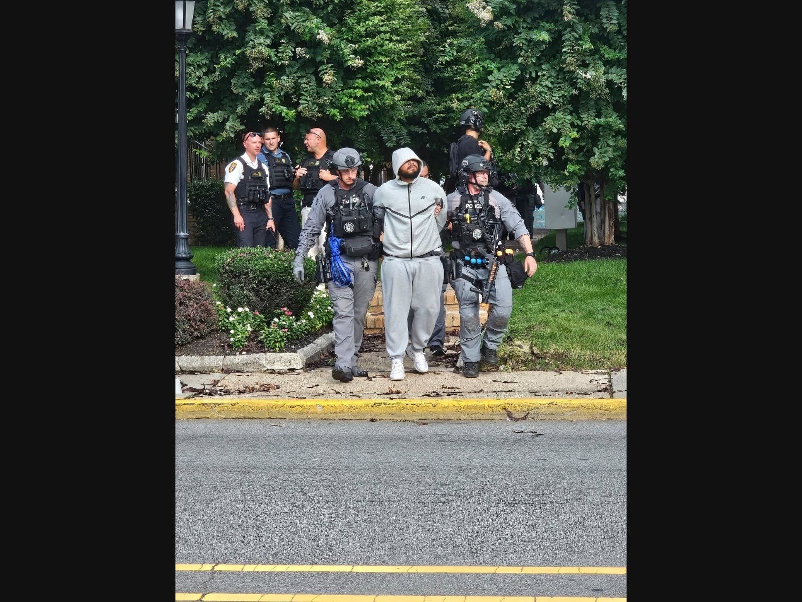 Sahil Ram escorted into custody after Plaza Gardens standoff