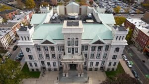 Jersey City rent control ordinance text strikes permanent exemptions for redevelopment-area towers and converted hotels